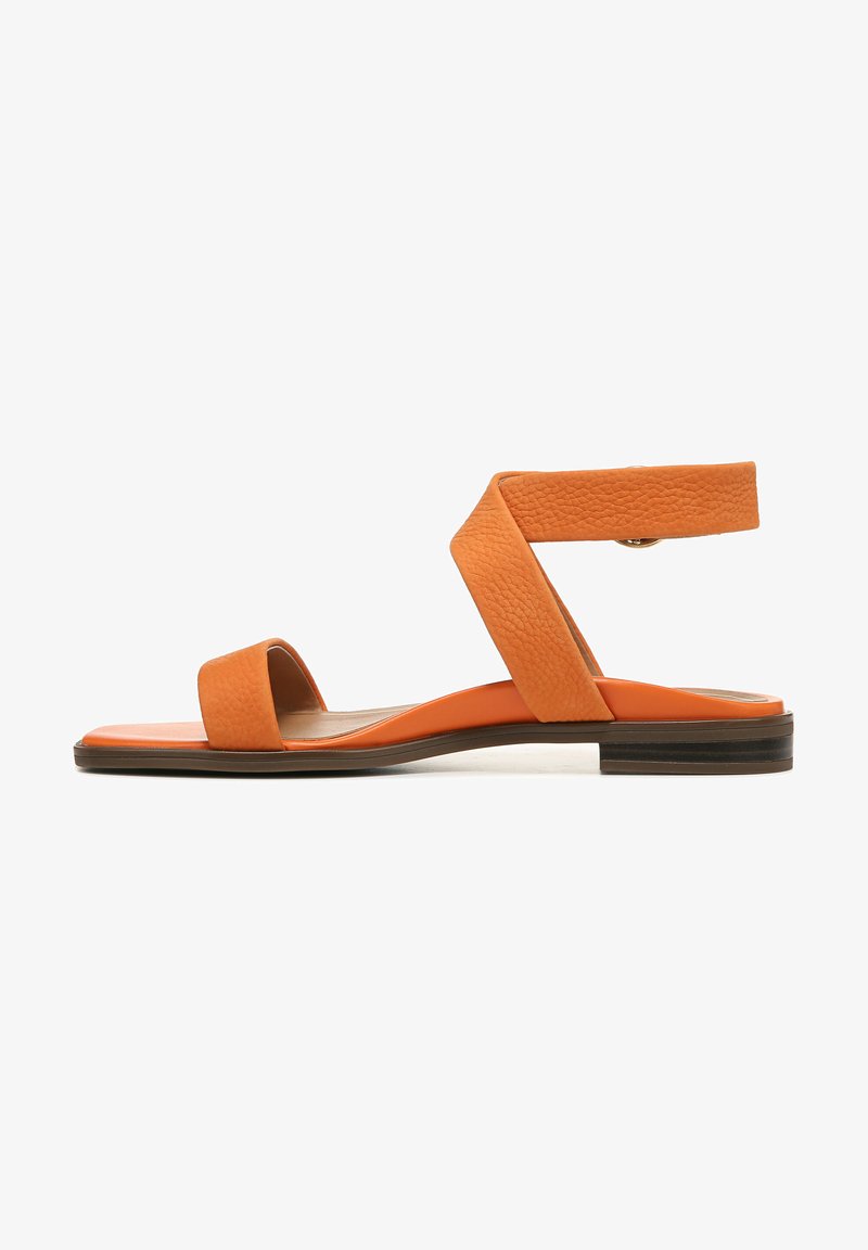 Orange leather sandal with a flat sole, featuring wide bands across the foot and an ankle strap with a textured finish.