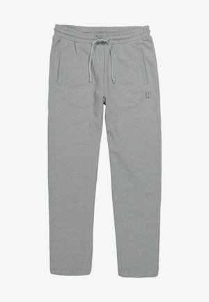 Grau Sweatpants aus weichem Material mit zwei Seiten Taschen, einem elastischen Bund und einer Schnur, versehen mit einem kleinen goldenen Logo an der Seite.