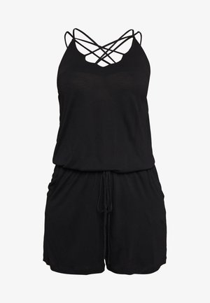 Black romper featuring a crisscross strap design, a v-neckline, drawstring waist, and soft textured fabric. Shorts length with relaxed fit.