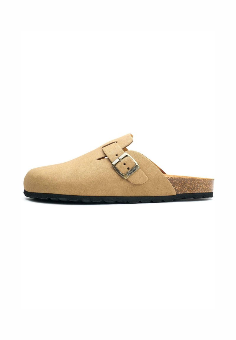 Beige suede clog with a rounded toe, adjustable metal buckle, cork footbed, and black rubber outsole. No heel.
