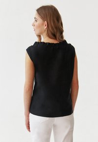 TATUUM IXA - Blusa - black