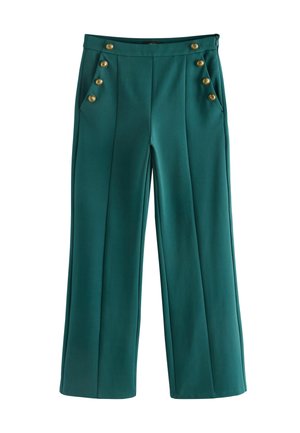 Teal levelehded trousers, valmistettu sileästä kankaasta, jossa on kultaiset napit taskuissa ja edessä, terävillä laskoksilla lisäyksinä.