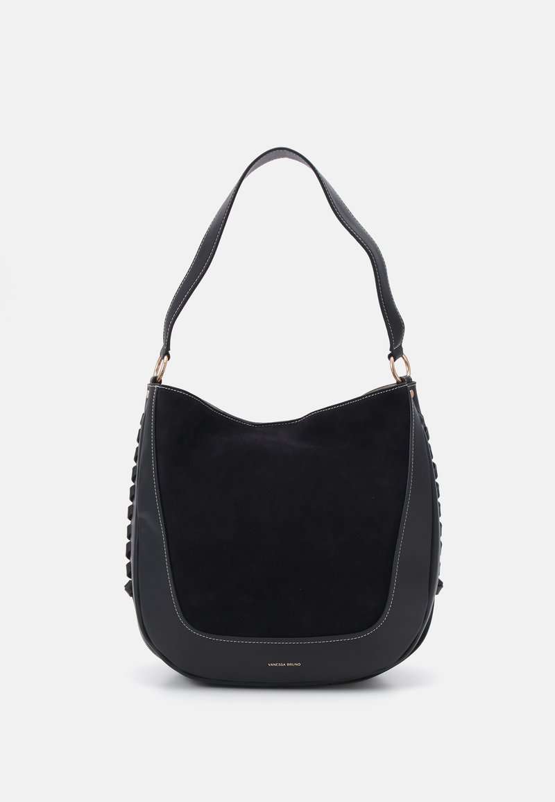 Black handbag made of soft suede with a curved silhouette. Features a flat handle and decorative stitching along the sides. Gold logo detail.