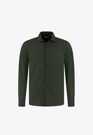 Mørkegrøn langærmet skjorte med knap-down krave og frontlukning med knapper. Har et subtilt logo på brystet og en glat tekstur.