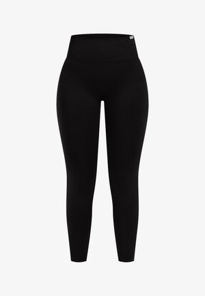Leggings noirs avec une taille haute côtelée. Fabriqués en tissu extensible avec une texture lisse. Design ajusté de la taille jusqu'à la cheville.