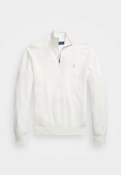 White half-zip pullover made of textured fabric. Features long sleeves, ribbed cuffs, and a small logo on the left chest.