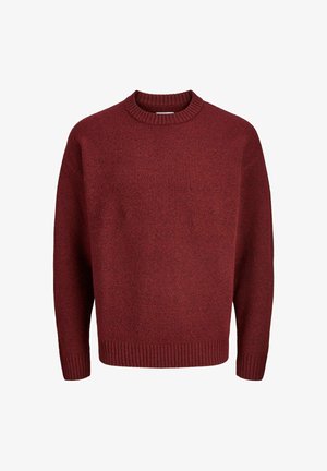 Pull en tricot rouge avec un col rond, des poignets et un ourlet côtelés, présentant un tissu texturé. La silhouette est décontractée et surdimensionnée.