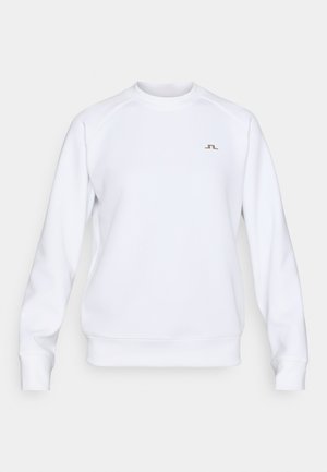 White sweatshirt made of smooth fabric, featuring a ribbed crew neck, raglan sleeves, and a small gold logo on the chest.