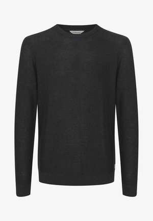 Juodas megztinis su apvalia iškirpte, ilgomis rankovėmis ir gumbuota apatine dalimi. Audinys turi subtilią tekstūrą ir lengvą išvaizdą.