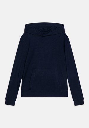 Tummansininen huppari, jossa on pitkät hihat, ribbikuvio, etutasku ja rento malli. Pehmeä materiaali ja minimalistinen muotoilu.