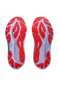 Outsole of a pair of sneakers with gray base and bright red textured traction patterns for grip and durability.