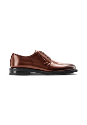 Brown leather men's dress shoe with black sole and closed lacing, shown in side profile on white background.