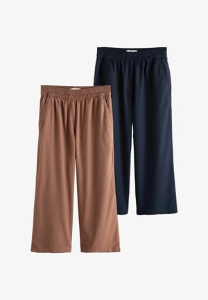 Kaks paari lahtist pükse elastsete vöödega, üks pruun ja üks tumel sinine, mõlemad küljetaskutega.