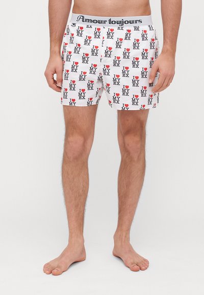 White boxers with "I LOVE MY EX" printed in black and red, featuring an elastic waistband with "Amour toujours" text.