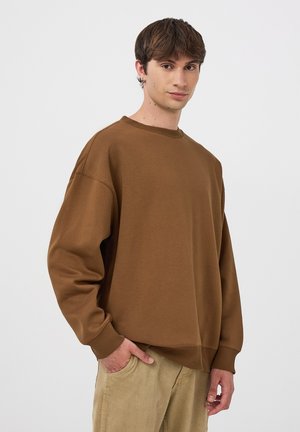 OVER SENZA - Felpa - coccio