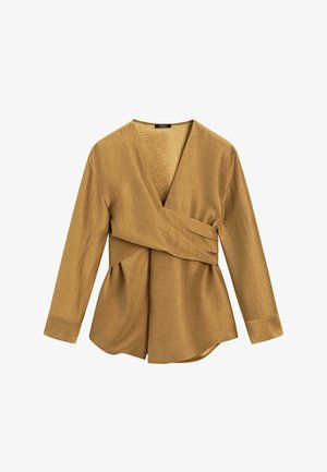 Top avvolgente oro a maniche lunghe con finitura testurizzata e design plissettato. Caratterizzato da una profonda scollatura a V e un orlo asimmetrico.