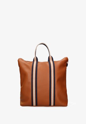 Leather tote bag in brown with textured surface, featuring two navy and cream striped handles and an open-top design.