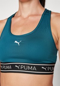 Puma KEEPS BRA - Sujetadores deportivos con sujeción media - cold green