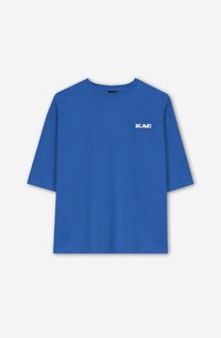 Blue cotton t-shirt with short sleeves, featuring a white logo on the chest. The design is simple, with a relaxed fit and round neckline.