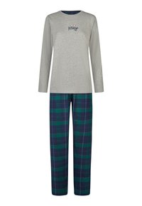 Graues Langarmshirt mit der Aufschrift "Holidays", kombiniert mit grün-navyfarbenen karierten Hosen mit weißen Nähten und lockerem Schnitt.