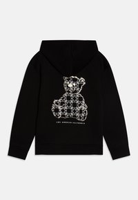 Felpa nera con cappuccio caratterizzata da una grafica di un orso bianco sul retro, circondato da un motivo decorativo, con la scritta "LOS ANGELES CALIFORNIA" sotto.