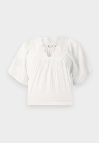 Vit blus med korta puffärmar, texturert tyg, scallopad halsringning och broderade detaljer runt kragen. Avslappnad passform.