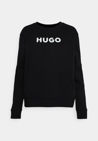 Sudadera negra de manga larga, cuello redondo y con un logo blanco "HUGO" en el pecho. Elaborada en suave material de algodón.
