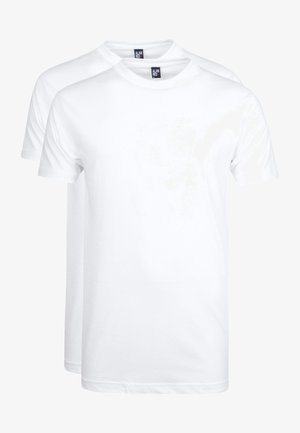 Twee plain witte katoenen T-shirts met ronde hals, korte mouwen en een standaard pasvorm, iets overlappend gestapeld.