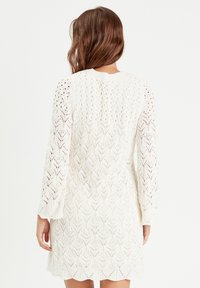 Cache Cache LOCHMUSTER - Strickkleid - ecru