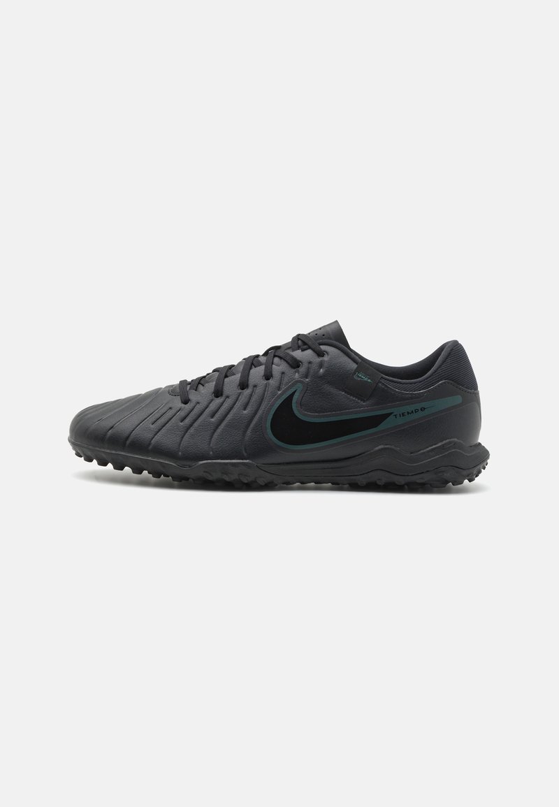 Black soccer shoes with textured synthetic upper, rounded toe, and black rubber outsole. Features a green Nike logo and "Tiempo" branding.
