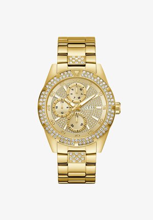 Kullatooni metallist käekell kristallaktsentidega, kolme abiketta päevade, 24-tunni ja sekundite näitamiseks ning kristallidega kaunistatud lingitud rihmaga.