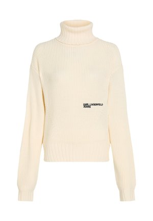 Jersey de cuello alto en color crema con textura acanalada y diseño corto. Presenta un sutil logo "KARL LAGERFELD JEANS" en el lado izquierdo del pecho.
