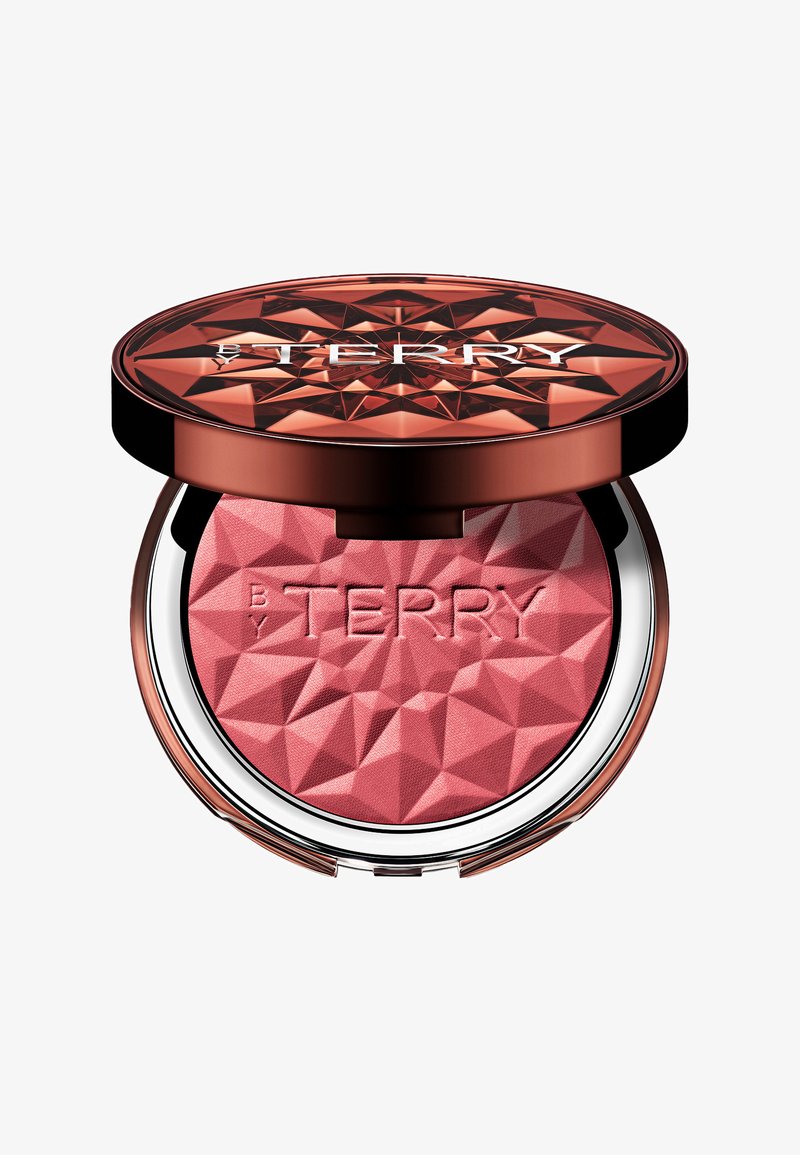 Rouge-Puder in einem kompakten Format mit rosarosa, facettiertem Puder und einem glänzenden roségoldenen Deckel. Mit eingraviertem Logo auf der Oberfläche und einer reflektierenden silbernen Unterseite.