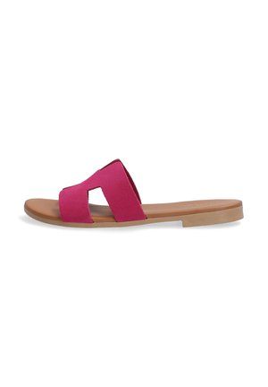 Fuchsia slide sandal with two wide, textured straps and a flat, tan sole. Open-toe design, minimalist style, and soft material.