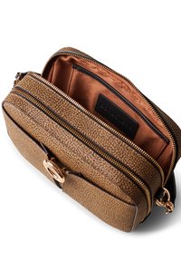 Brown textured leather bag with two zip compartments, gold hardware accents, and a smooth interior lining. Features a branded tag inside.