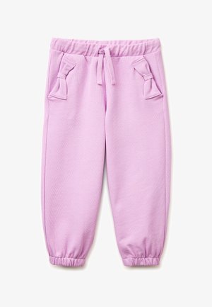 Fliederfarbene Jogginghose für Kinder mit elastischem Bund, Kordelzug, elastischen Bündchen und dekorativen Schleifendetails auf den vorderen Taschen.