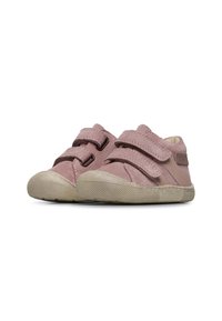 Light pink children's shoes with two velcro straps, round toe design, and a textured rubber sole. Features a soft inner lining.