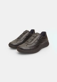 Black leather slip-on shoes with padded top, rounded toe, and textured sole. Smooth finish with subtle stitching details, no laces.