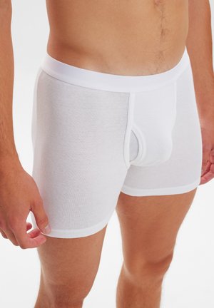 Weiße Baumwoll-Boxershorts mit einem enganliegenden Design, elastischem Bund und einer strukturierten Oberfläche. Verfügt über eine Fronttasche zur Unterstützung.