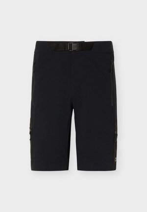Schwarze kniehohe Shorts mit integriertem verstellbarem schwarzen Gürtel und mehreren Reißverschlusstaschen vorne und an den Seiten.