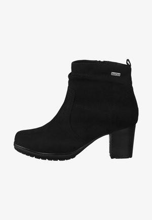 Black suede ankle boots with a rounded toe, a cylindrical heel, and a smooth upper featuring minimal stitching and a small logo accent.