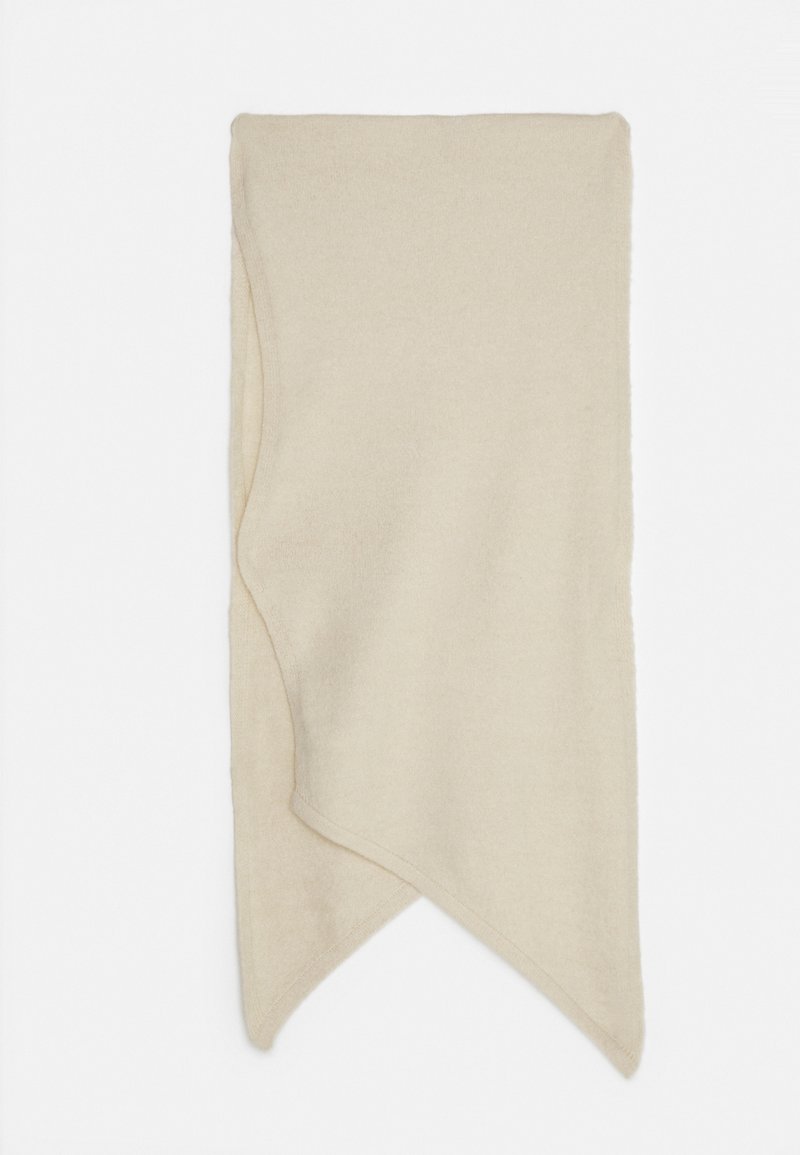 Écharpe beige douce avec des extrémités pointues asymétriques, affichée à plat sur un fond blanc.