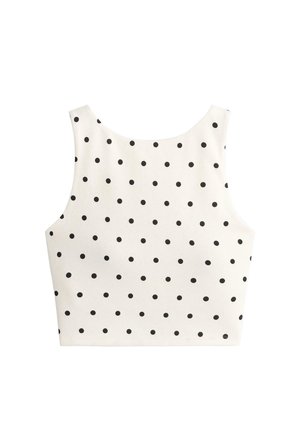 Top alb fără mâneci, scurtat, cu buline negre mici, dispuse uniform, și cu decolteu rotund, afișat întins pe un fundal alb.