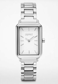 Silberne rechteckige Uhr mit einem eleganten Metallarmband. Weißes Zifferblatt mit minimalistischen Stundenmarkierungen und einer kleinen Krone an der Seite.