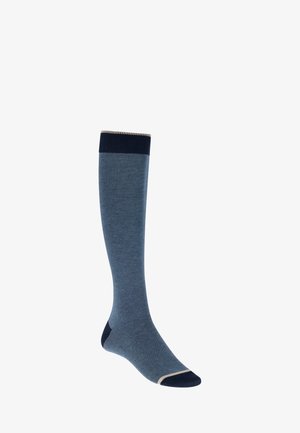 Chaussette bleue montant jusqu'au genou avec un revers, un talon et un bout en bleu marine, ornée de fines rayures horizontales et d'une bordure beige sur le revers et le bout.
