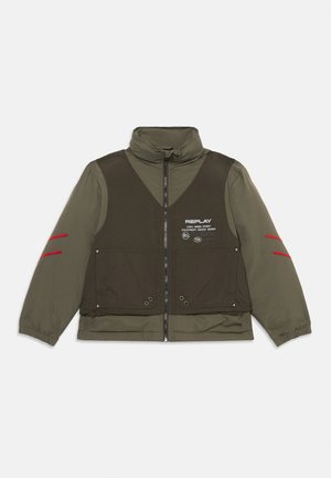 Olive green jacket featuring a dark brown front panel, high collar, zip closure, red accents on sleeves, and logo detail on chest.