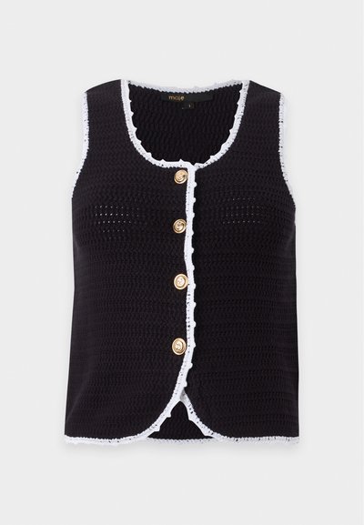 Gilet sans manches en maille noire avec bordure blanche et quatre boutons dorés sur le devant sur un fond uni.