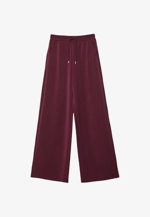 Bordeaux wijde broek van zacht stof, met een elastische tailleband en een koord, en zijzakken. Vrijwel overal een gladde textuur.