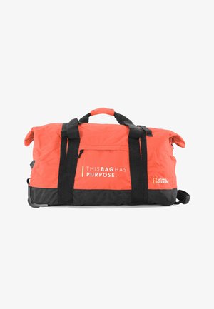 Red and black duffel bag featuring a zippered pocket, multiple black straps, and a printed design stating "THIS BAG HAS PURPOSE."