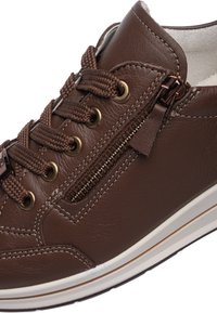 Brown leather sneaker with textured finish, round toe, lace-up design, gold-tone eyelets, and side zipper detail. Rubber sole with white trim.